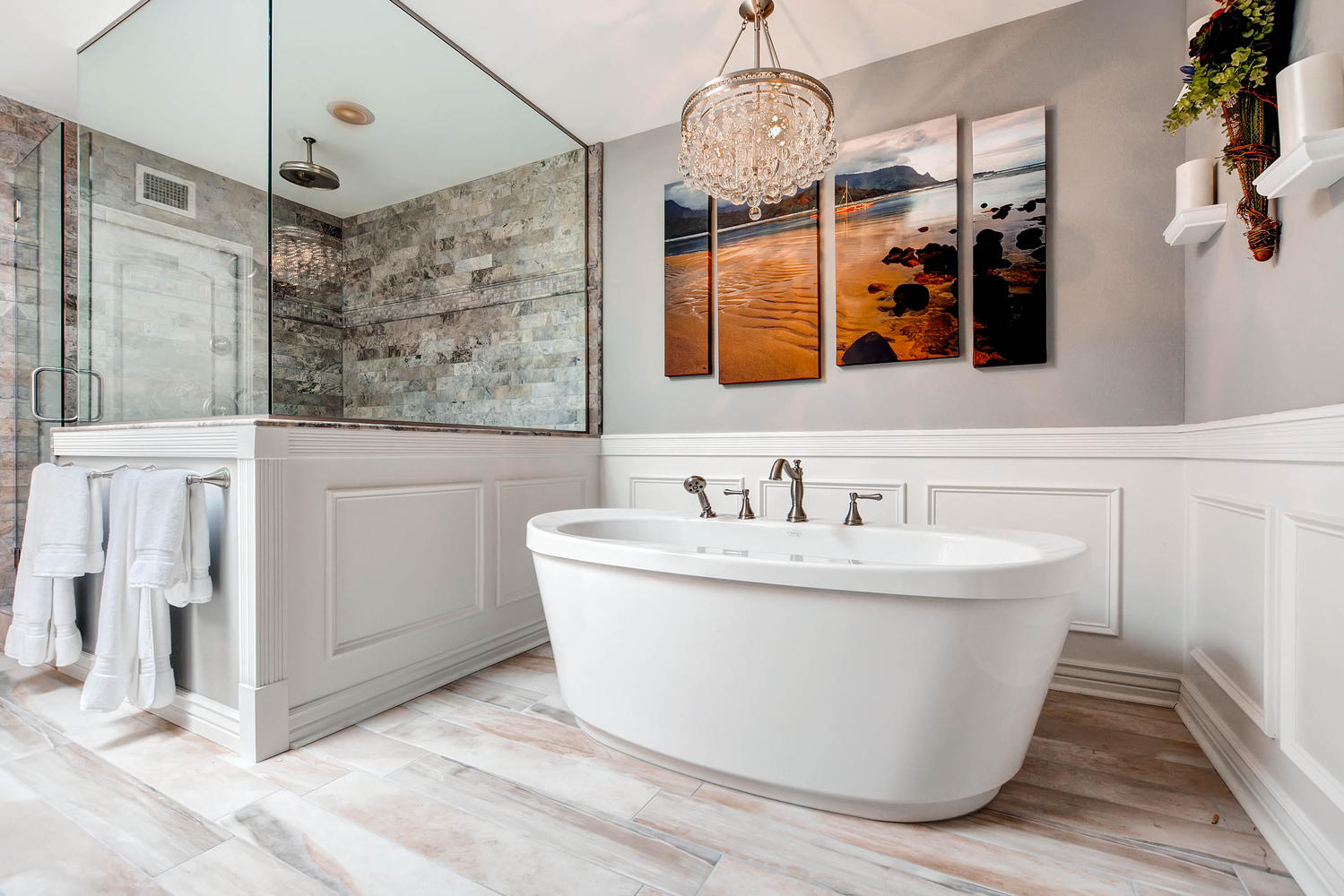 Luxury master bath with freestanding tub and chandelier