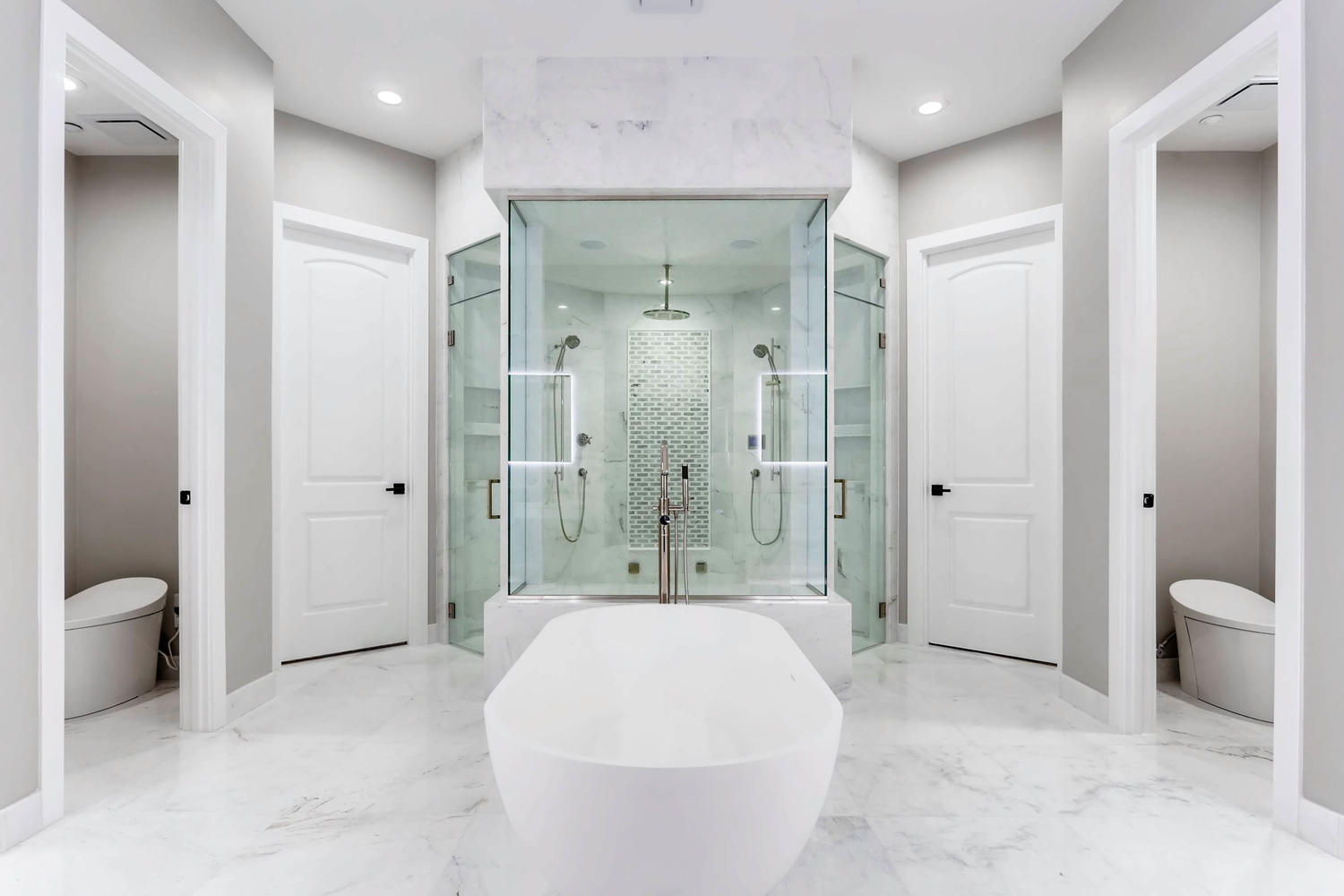 Marble master bathroom with glass shower