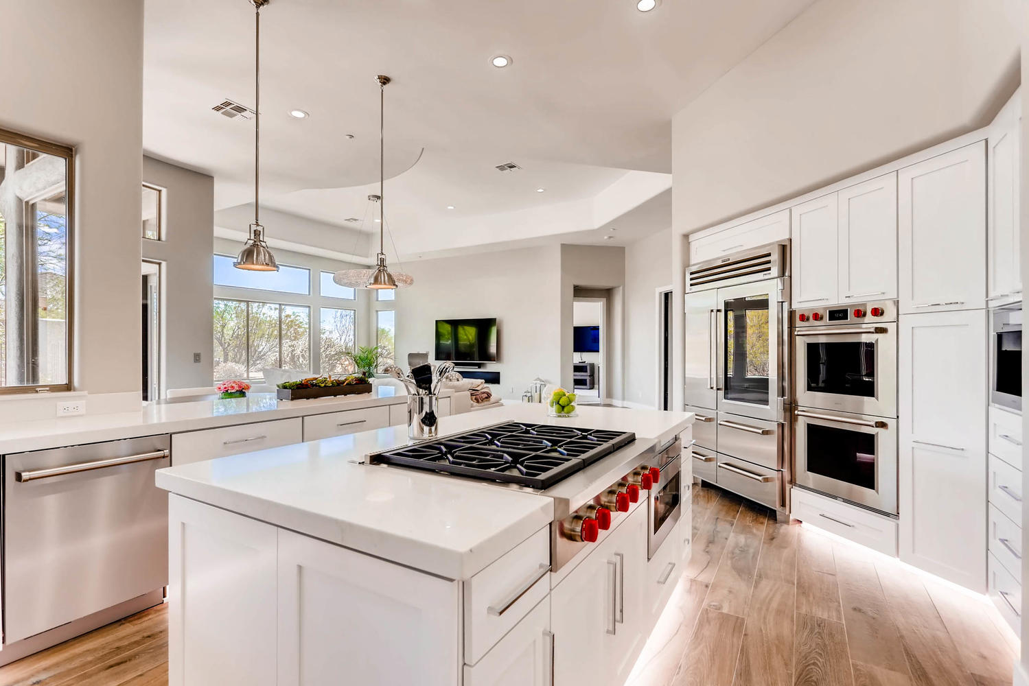 Custom white kitchen with island cooktop